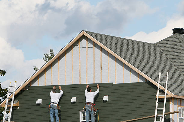 Professional Storm Damage Siding Repair technician working in Deltaville, VA